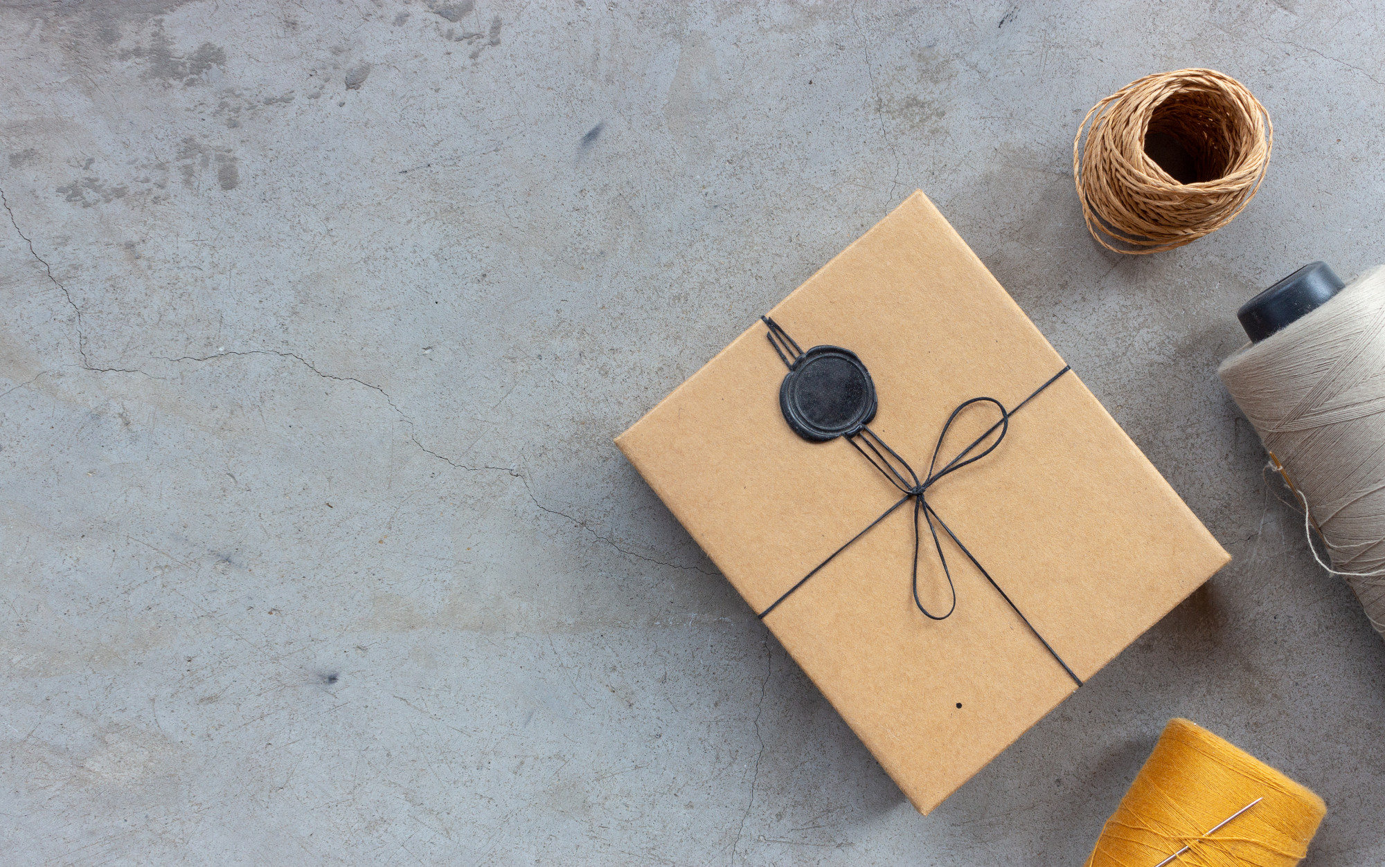 Flatlay parcel and embroidered label
